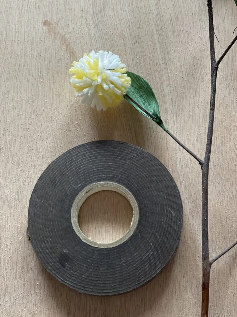 Completed Kadam flower with flower tape wrapped stem, front view
