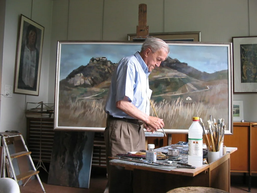 Pierre Bichet in his studio in Pontarlier, August 2004, surrounded by his paintings