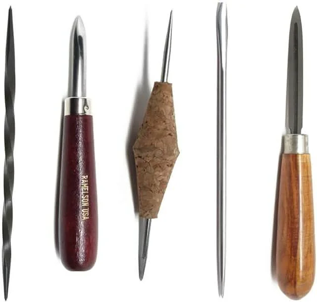 Set of etching needles and tools including roulettes, scrapers, and burnishers for printmaking