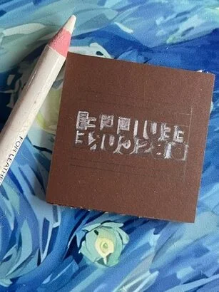 I used a white or light-colored pencil to mark the areas that will be cut